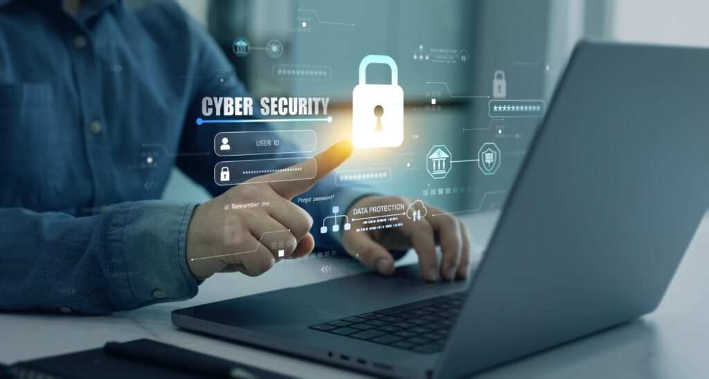 Person interacting with cybersecurity interface on laptop.